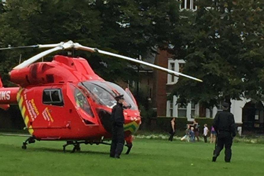 Police officers on Turnham Green in Chiswick after a man fell from a building and died (@JaneWriting1)