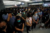 Protest at Yuen Long MTR station, the scene of an attack by suspected triad gang members a month ago