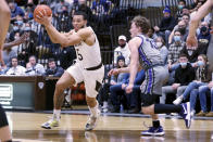 St. Bonaventure guard Jaren Holmes (5) drives to the basket as Northern Iowa guard Bowen Born (13) guards him during the first half of an NCAA college basketball game, Saturday, Nov. 27, 2021, in Olean, N.Y. (AP Photo/Bryan Bennett)