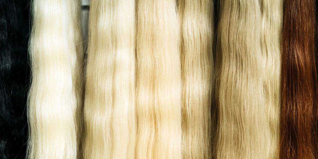 strands of natural hair in different colors and shades for hair extensions