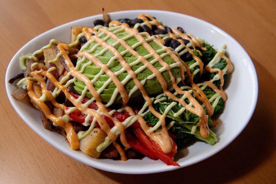 The Smoking’ Onion’s bodhi bowl comes with seared and steamed broccoli, kale, potato medley with onions, black beans, red bell pepper, avocado and drizzled with cilantro goddess dressing and chipotle Baja sauce.