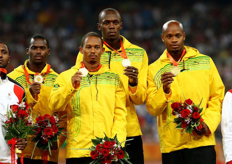 BEIJING - AUGUST 23: (L to R) Nesta Carter, Michael Frater, Usain Bolt and Asafa Powell of Jamaica receive their gold medals during the medal ceremony for the Men's 4 x 100m Relay Finalheld at the National Stadium on Day 15 of the Beijing 2008 Olympic Games on August 23, 2008 in Beijing, China. (Photo by Julian Finney/Getty Images)