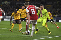 Arsenal's Martin Odegaard scores his side's second goal during the English Premier League soccer match between Wolverhampton Wanderers and Arsenal at the Molineux Stadium in Wolverhampton, England, Saturday, April 20, 2024. (AP Photo/Rui Vieira)