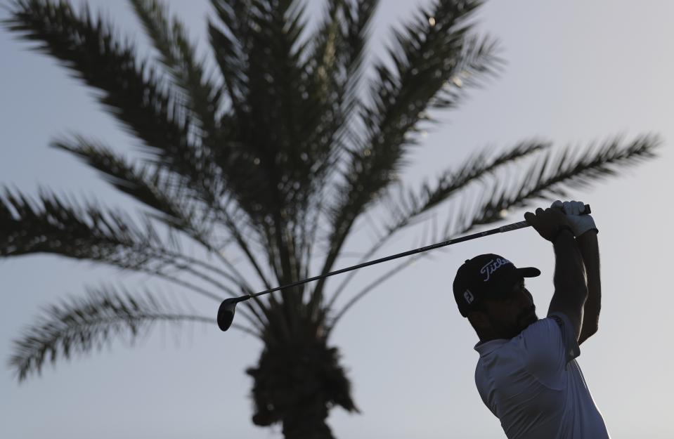 Italy's Francesco Laporta tees off on the 18th hole during the third round of the Abu Dhabi Championship golf tournament in Abu Dhabi, United Arab Emirates, Saturday, Jan. 18, 2020. (AP Photo/Kamran Jebreili)