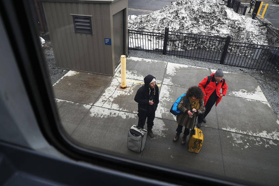 People wait for arrival of Amtrak train