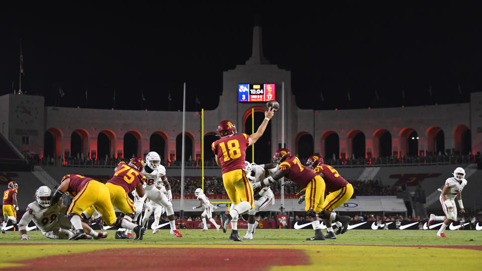 Southern California quarterback JT Daniels, center, passes during the first half of an NCAA college football game against Fresno State Saturday, Aug. 31, 2019, in Los Angeles. (AP Photo/Mark J. Terrill)
