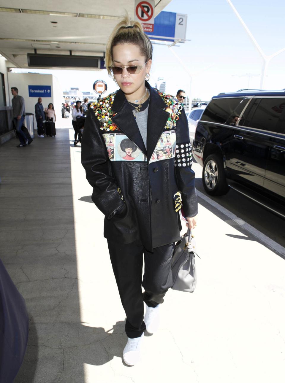 <p>WHO: Rita Ora</p> <p>WHAT: Prada, Hermès bag, Nike shoes</p> <p>WHERE: Los Angeles International Airport</p> <p>WHEN: March 28, 2018</p>