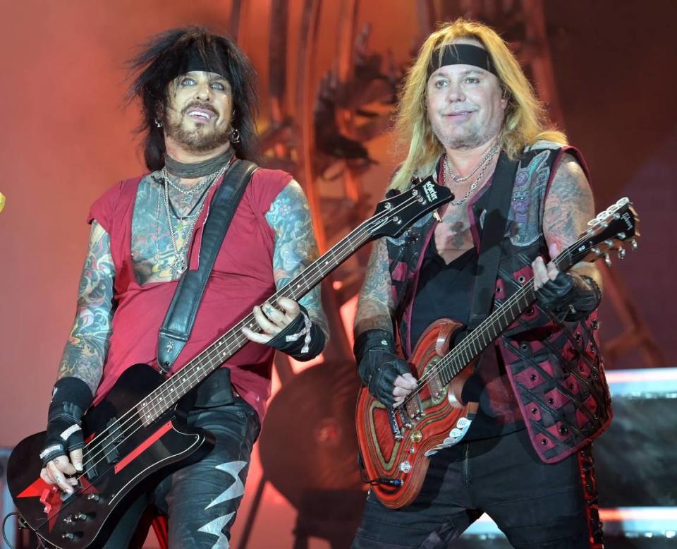 Motley Crue members Nikki Sixx, left and Vince Neil, right, perform during The Stadium Tour 2022 at Bank of America Stadium in Charlotte, NC on Tuesday, June 28, 202. The concert featured Classless Act, Joan Jett and The Blackhearts, Poison and Def Leppard.