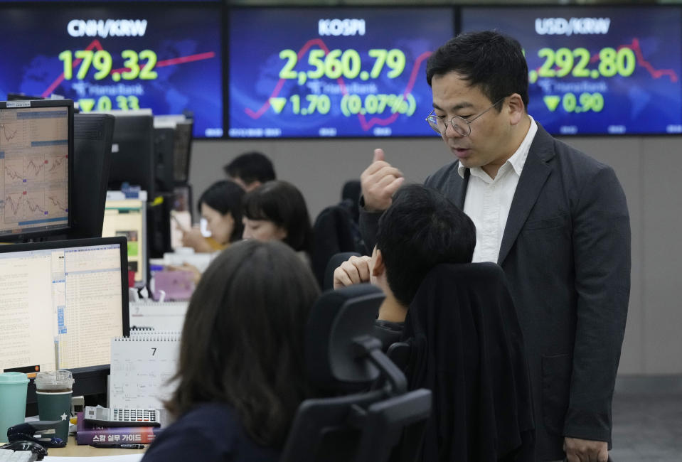 Currency traders work at the foreign exchange dealing room of the KEB Hana Bank headquarters in Seoul, South Korea, Wednesday, July 12, 2023. Asian shares were mostly higher on Wednesday after stocks advanced on Wall Street as investors awaited an update on U.S. inflation that will hopefully show a smaller increase in pain for everyone. (AP Photo/Ahn Young-joon)