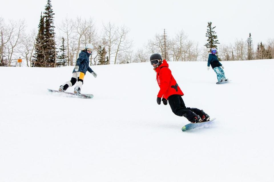 Snowboarders on the slopes in Aspen Snowmass