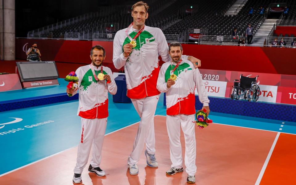 Mehrzad Mehravan # 1, Morteza Mehrzad # 2 and of Team Islamic Republic of Iran celebrates its gold medal win over Team Russian Paralympic Committee during the men's sitting volleyball gold match - GETTY