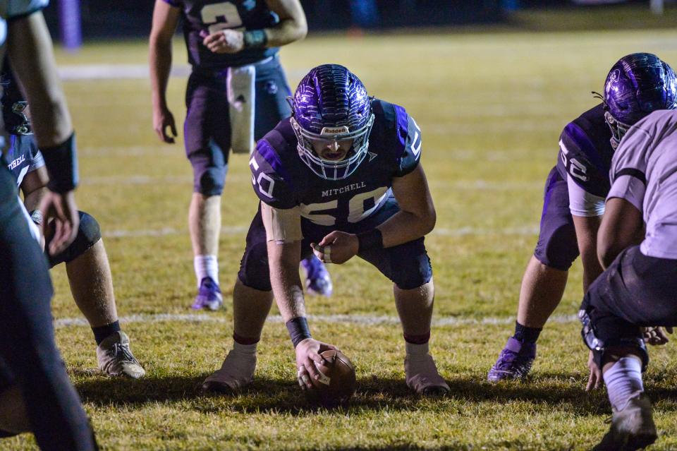 Mitchell's Jackson Foxx (50) sets the ball during their game against Robbinsville on December 3, 2021. Mitchell defeated Robbinsville 34-21 to become the 2021 regional champions.