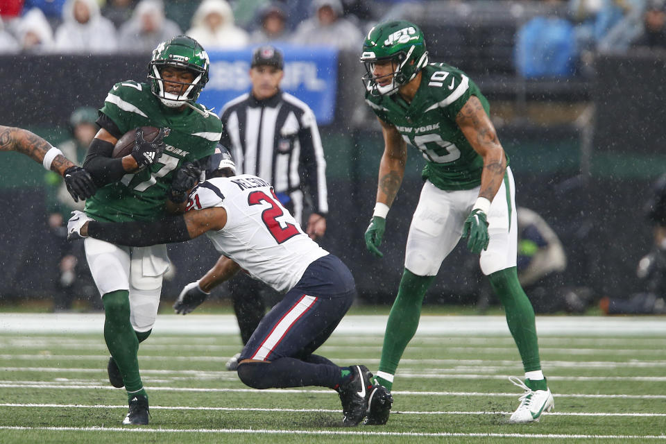 New York Jets wide receiver Garrett Wilson (17) is tackled by Houston Texans cornerback Steven Nelson (21) during the second quarter of an NFL football game, Sunday, Dec. 10, 2023, in East Rutherford, N.J. (AP Photo/John Munson)