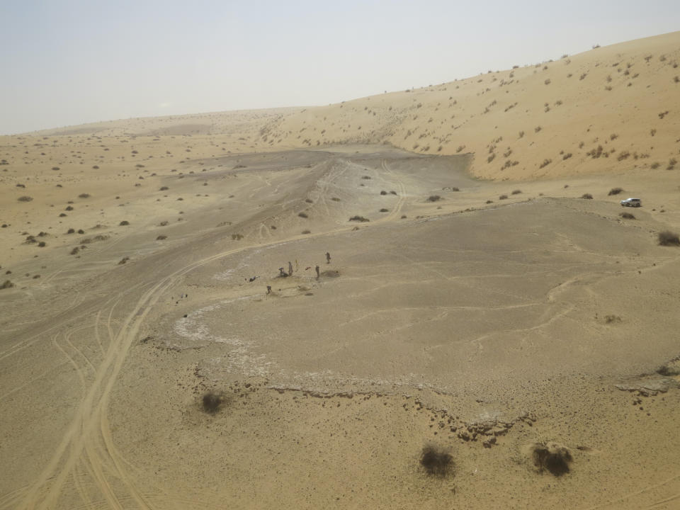 This undated photo provided by the Palaeodeserts Project in September 2021 shows the site of Khall Amayshan 4 in northern Saudi Arabia, where evidence of repeated visits by early humans over the last 400,000 years was found, associated with the remains of ancient lakes. (Michael Petraglia/Palaeodeserts Project via AP)