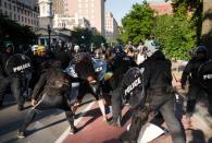 Riot police clear Lafayette Park for a photo opportunity by President Donald Trump in Washington