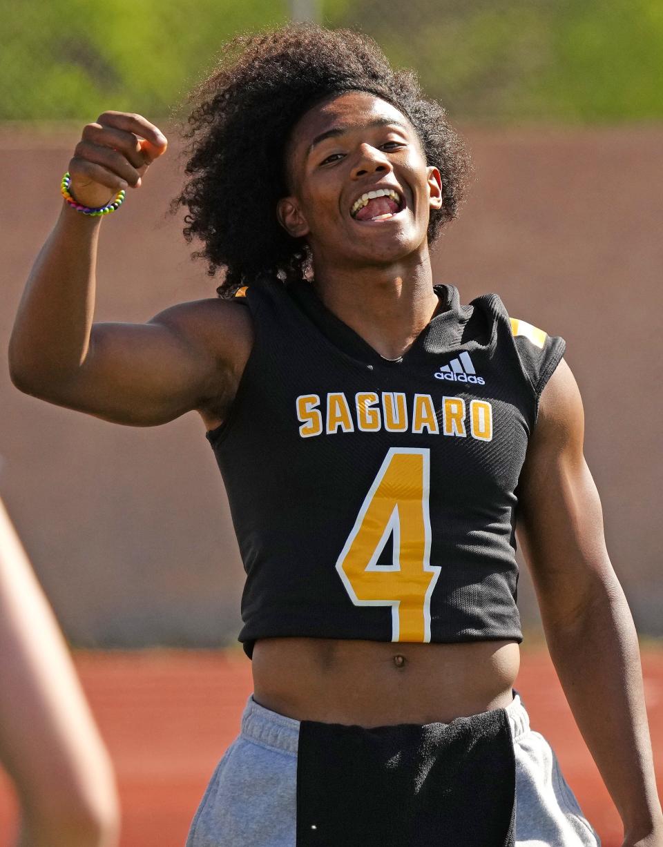 Saguaro linebacker Joseph Clark IV (4) talks with teammates during a spring practice at Saguaro High School in Scottsdale on April 25, 2023.