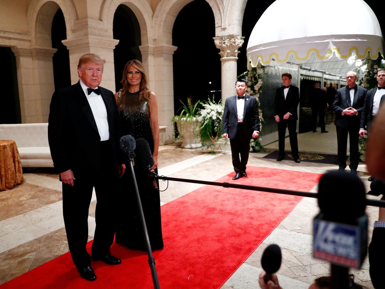 <p>US president Donald Trump and first lady Melania Trump at Mar-a-Lago</p> (REUTERS)