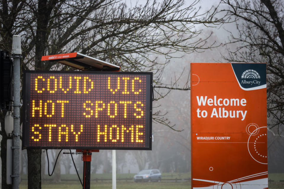 A sign is displayed regarding COVID-19 restrictions in the New South Wales/Victoria border town of Albury. Sources: Getty Images