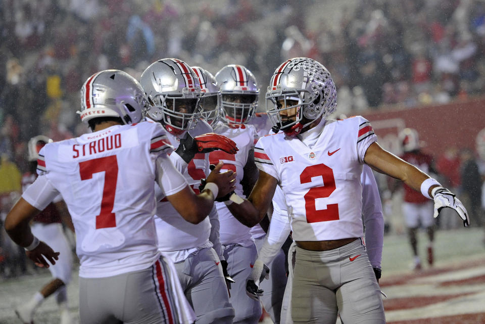 BLOOMINGTON, IN - OCTOBER 23: Ohio State Buckeyes wide receiver Chris Olave (2) high fives Ohio State Buckeyes quarterback C.J. Stroud (7) after a touchdown during the Big Ten conference college football game between the Ohio State Buckeyes and the Indiana Hoosiers on October 23, 2021, at Memorial Stadium in Bloomington, Indiana. (Photo by Michael Allio/Icon Sportswire via Getty Images)