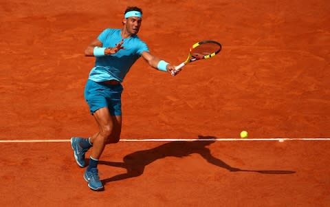 Rafael Nadal of Spain plays a forehand during his mens singles second round match against Guido Pella of Argentina during day five of the 2018 French Open at Roland Garros on May 31, 2018 in Paris, France - Credit: Getty Images