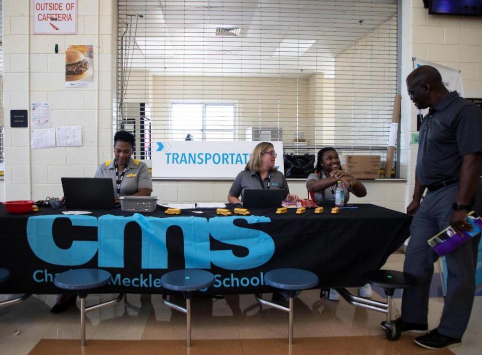 Charlotte-Mecklenburg Schools is short more than 500 teachers entering the school year. There are also bus driver and more than 150 cafeteria worker shortages. In this August 2022 file photo, CMS workers meet with a variety of people who are interested in working with in the schools at an operations hiring event at Phillip O’Berry High School in Charlotte, NC.