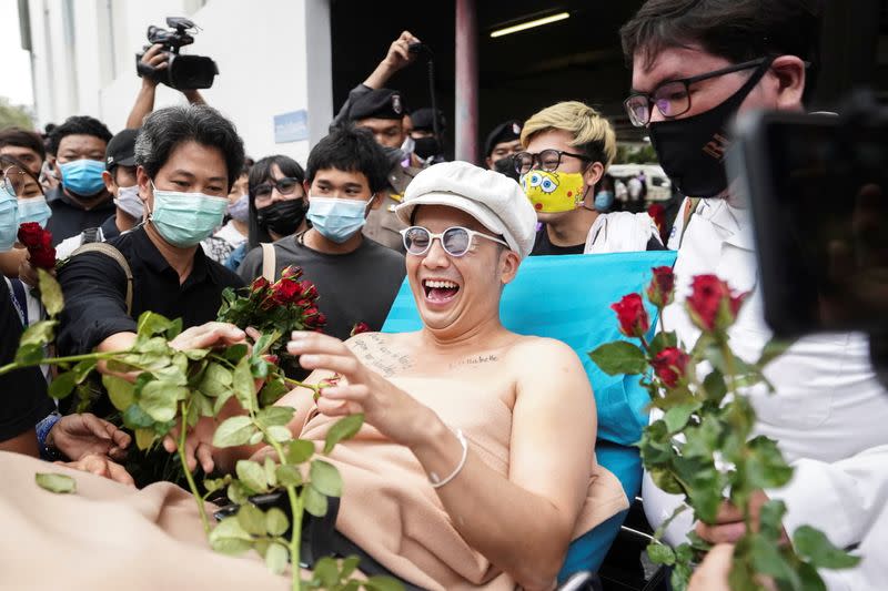 Musician and activist Chaiamorn "Ammy" Kaewwiboonpan arrives to report himself over royal insult charges in Bangkok