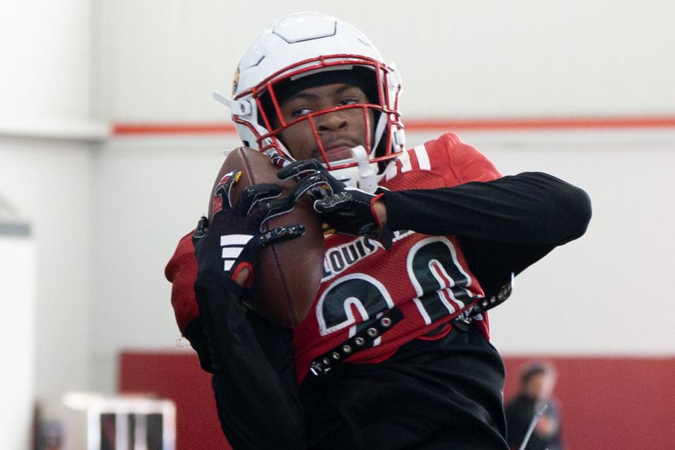 Louisville football Tayon Holloway (20) runs drills during spring practice on Saturday, March 23, 2024 at the Trager practice facility in Louisville, Ky.