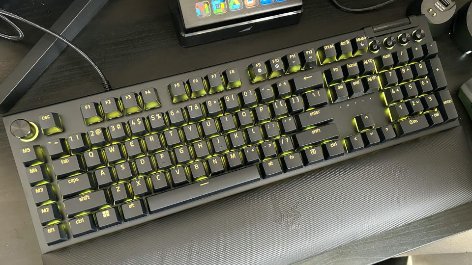 Razer BlackWidow V4 Pro gaming keyboard on a desk with gaming mouse and macro pad