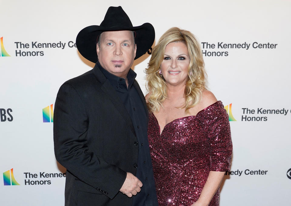 Country music singers Garth Brooks and Trisha Yearwood arrive for the 42nd Annual Kennedy Awards Honors in Washington, U.S., December 8, 2019.      REUTERS/Joshua Roberts