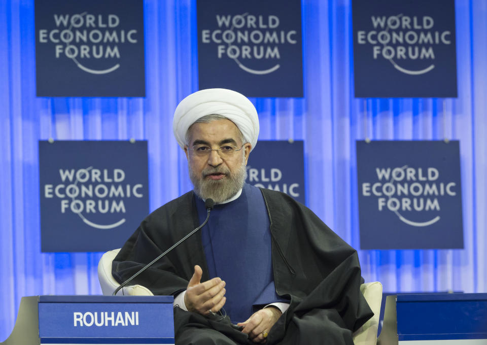 Iranian President Hassan Rouhani gestures as speaks during a session of the World Economic Forum in Davos, Switzerland, Thursday, Jan. 23, 2014. Leaders gathered in the Swiss ski resort of Davos have made it a top priority to push to reshape the global economy and cut global warming by shifting to cleaner energy sources. (AP Photo/Michel Euler)