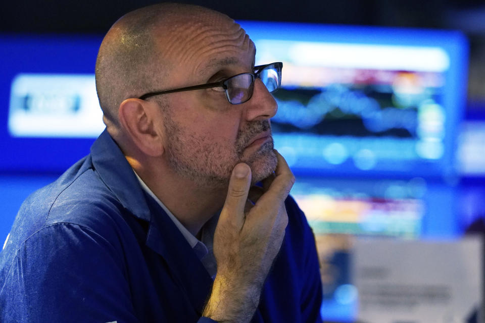 Specialist Peter Giacchi works at his post on the floor of the New York Stock Exchange, Friday, Aug. 25, 2023. (AP Photo/Richard Drew)