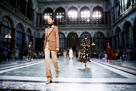 Models present creations during the Victoria Beckham catwalk show at London Fashion Week in London