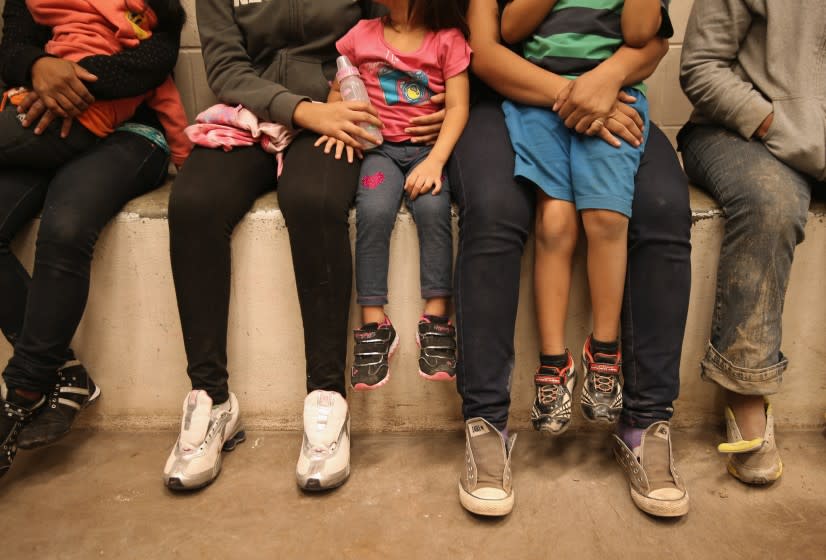 Women and children sit in a holding cell at a Border Patrol processing center after being detained by agents near the U.S.-Mexico border last September near McAllen, Texas. Hundreds of women with children are now being held at three detention centers run by the Department of Homeland Security.