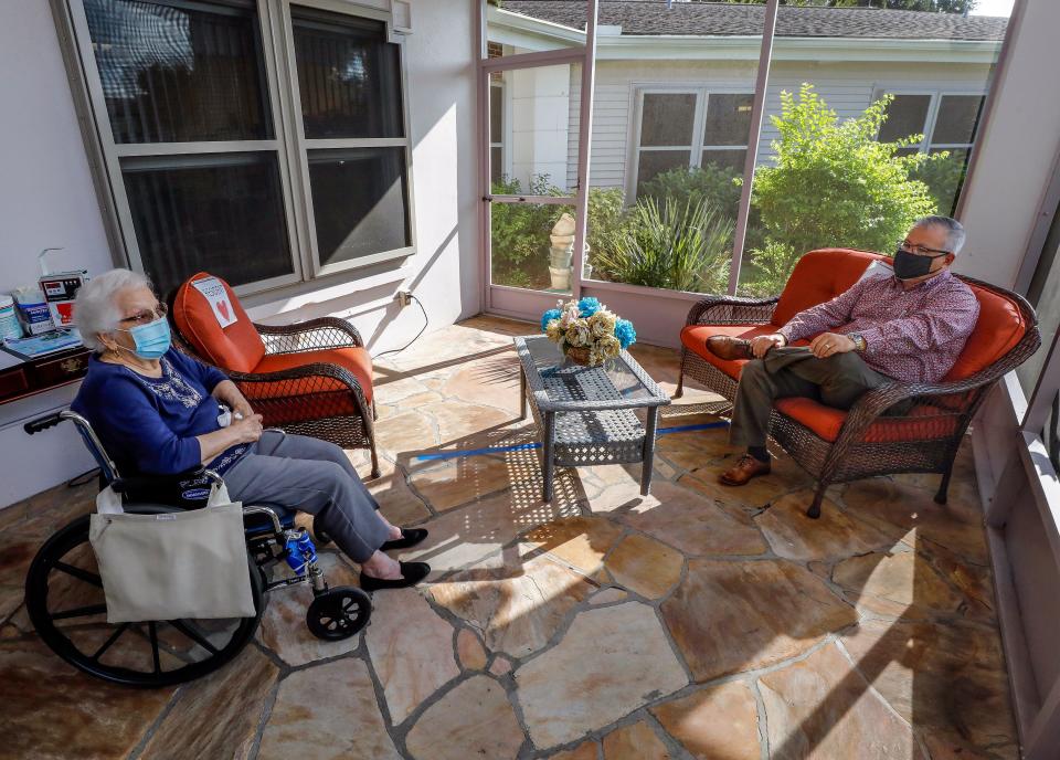 Lois Peacock is visited by her son, Steve Peacock, at the Rohr Home in Bartow. If the Rorh Home buyer does not wish to maintain it as a nursing home, current occupants will be transferred to another facility.