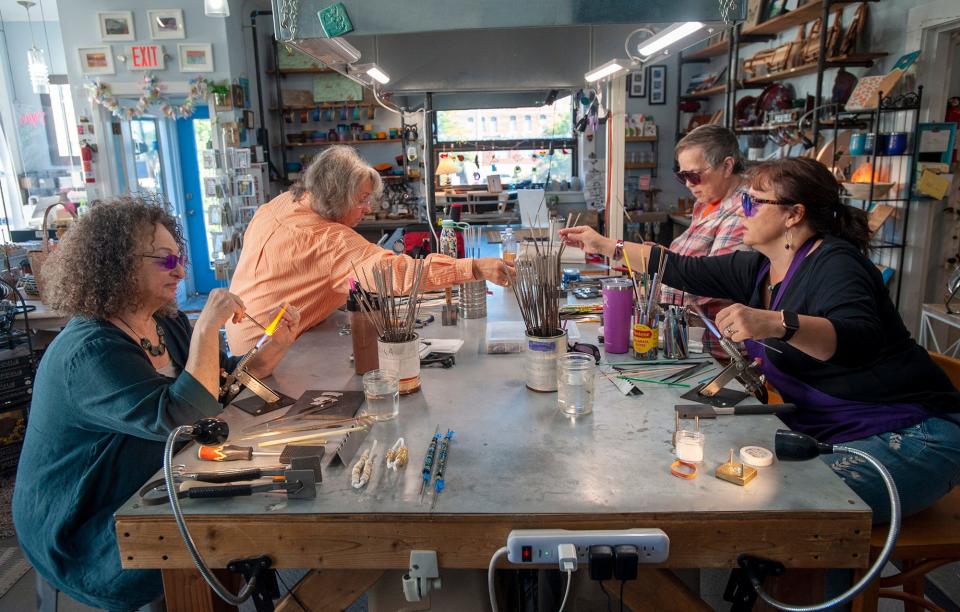 Participants in a recent glass making class at Elsie Kaye Glassworks in Westborough include, from left, resident artist and teacher Sheila Chekoway, of Natick; Nancy Barck, of Lancaster; Sari Bitticks, of Auburn; and owner Holly Kenny, Sept. 29, 2022.
