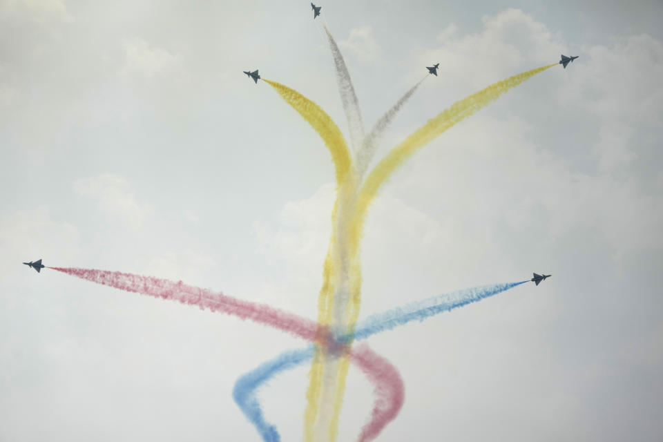 Members of the "August 1st" Aerobatic Team of the Chinese People's Liberation Army (PLA) Air Force perform during the 13th China International Aviation and Aerospace Exhibition, also known as Airshow China 2021, on Tuesday, Sept. 28, 2021, in Zhuhai in southern China's Guangdong province. (AP Photo/Ng Han Guan)