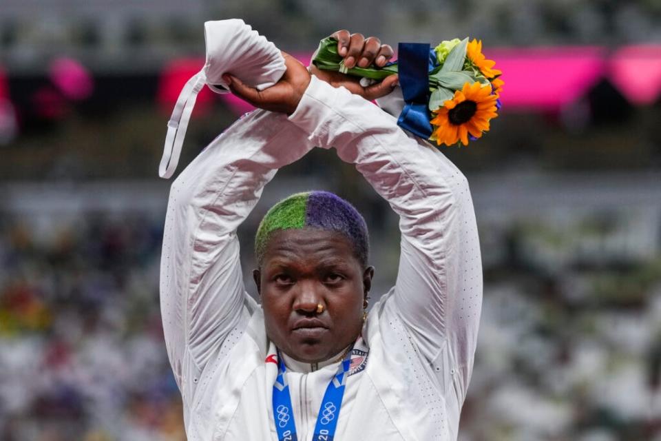 Raven Saunders poses with her silver medal on women’s shot put at the 2020 Summer Olympics, Sunday, Aug. 1, 2021, in Tokyo, Japan. (AP Photo/Francisco Seco)