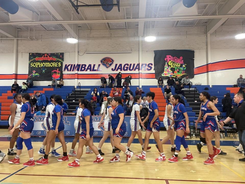 East Union and Kimball girls basketball shake hands after Jan. 24 game at Kimball High School.