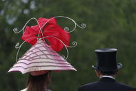 Racegoers arrive on the second day of the annual Royal Ascot horse race meeting in Ascot, England, Wednesday, June 19, 2019. (AP Photo/Alastair Grant)