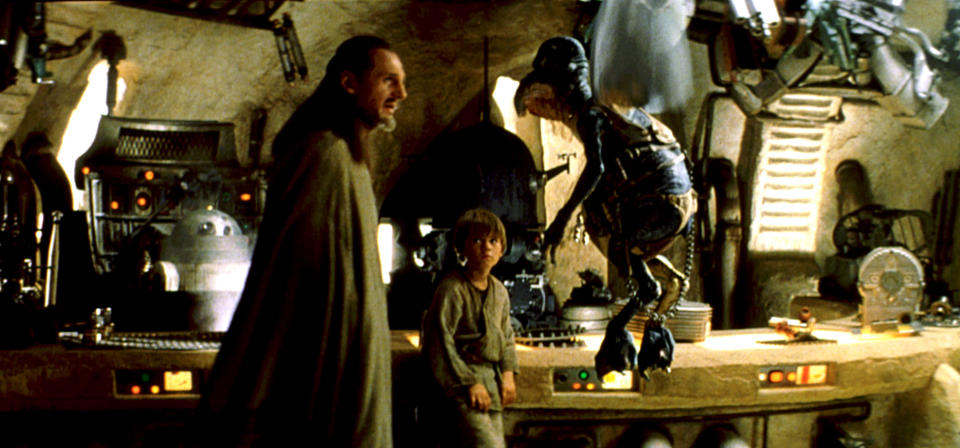 Qui-Gon Jinn bargains for Anakin's freedom with local merchant, Watto. (Photo: Lucasfilm Ltd./courtesy Everett / Everett Collection)