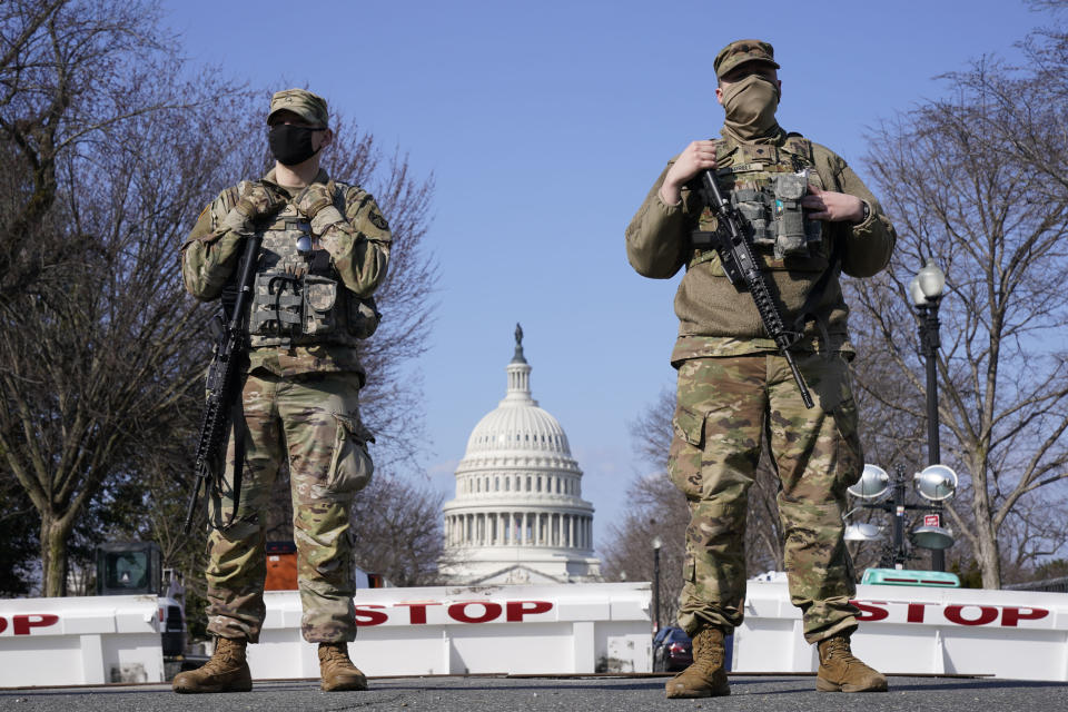 National Guard keep watch on the Capitol, Thursday, March 4, 2021, on Capitol Hill in Washington. Capitol Police say they have uncovered intelligence of a "possible plot" by a militia group to breach the U.S. Capitol on Thursday, nearly two months after a mob of supporters of then-President Donald Trump stormed the iconic building to try to stop Congress from certifying now-President Joe Biden's victory. (AP Photo/Jacquelyn Martin)