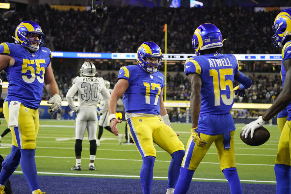 Los Angeles Rams quarterback Baker Mayfield (17) celebrates with teammates wide receiver Tutu Atwell (15) and center Brian Allen (55) after a touchdown by wide receiver Van Jefferson, right, during the second half of an NFL football game against the Las Vegas Raiders, Thursday, Dec. 8, 2022, in Inglewood, Calif. (AP Photo/Marcio Jose Sanchez)