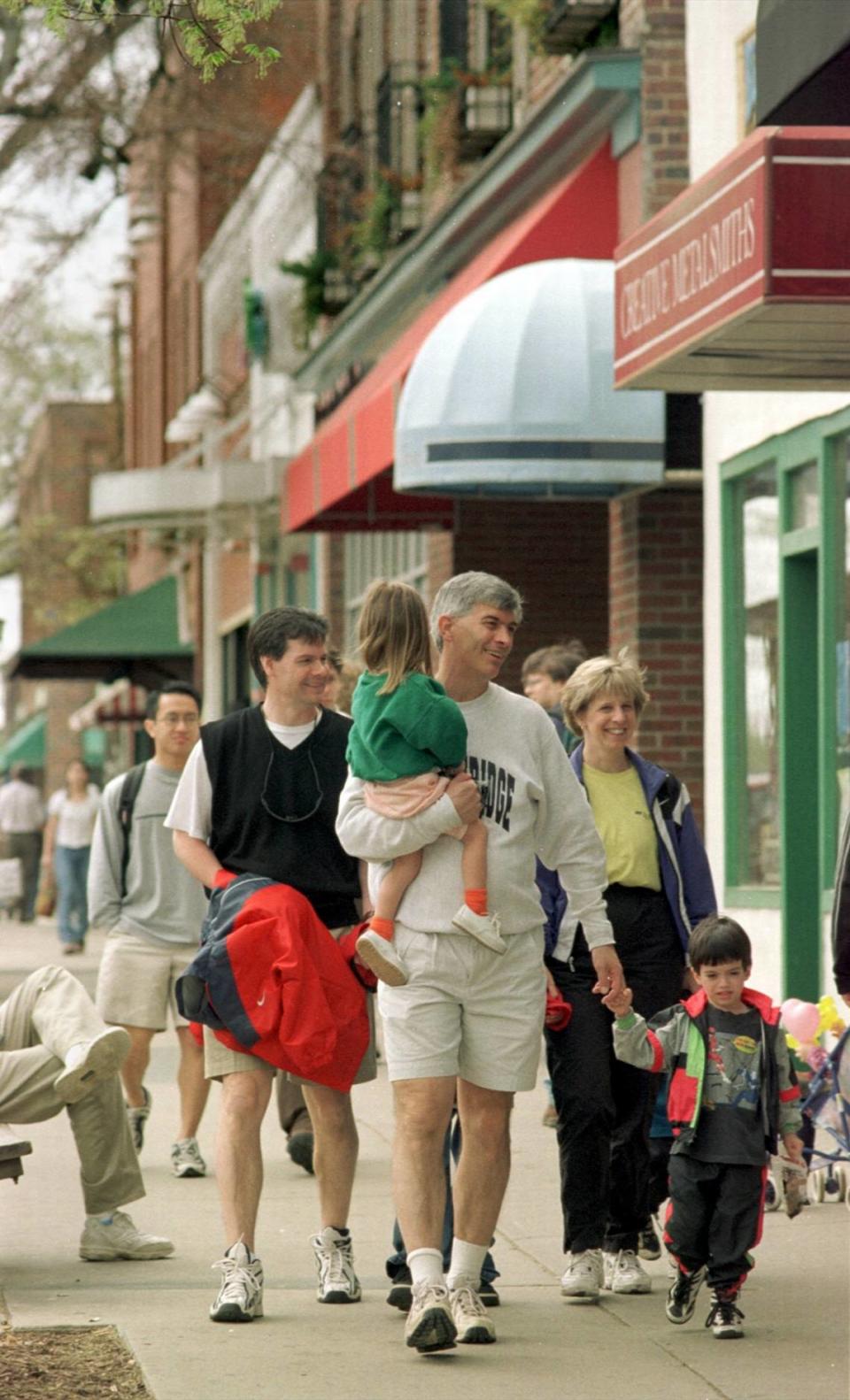 A family walks down Franklin Street in Chapel Hill in 1999.