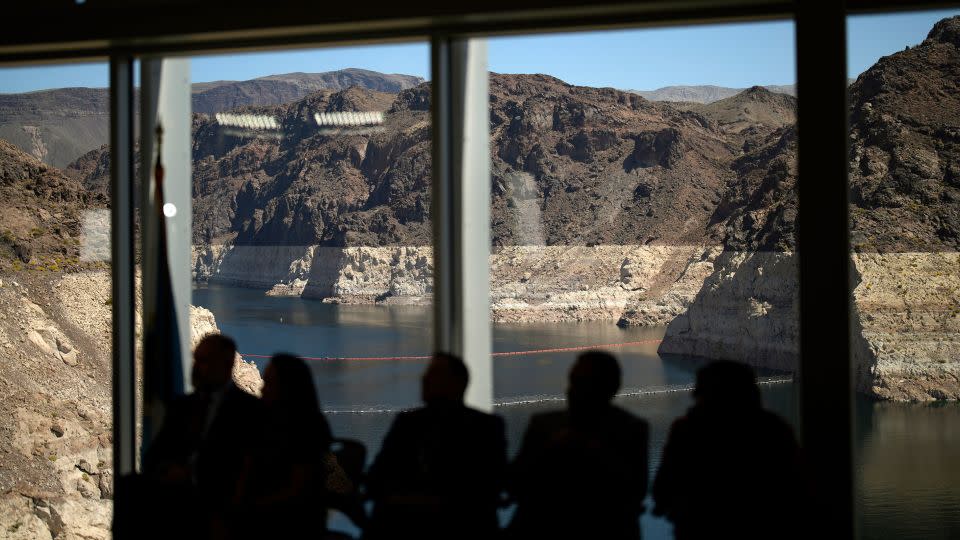 Officials listen during a news conference at the Hoover Dam on Lake mead on April 11. - John Locher/AP