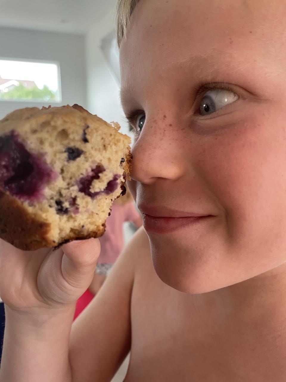 author's son with a muffin