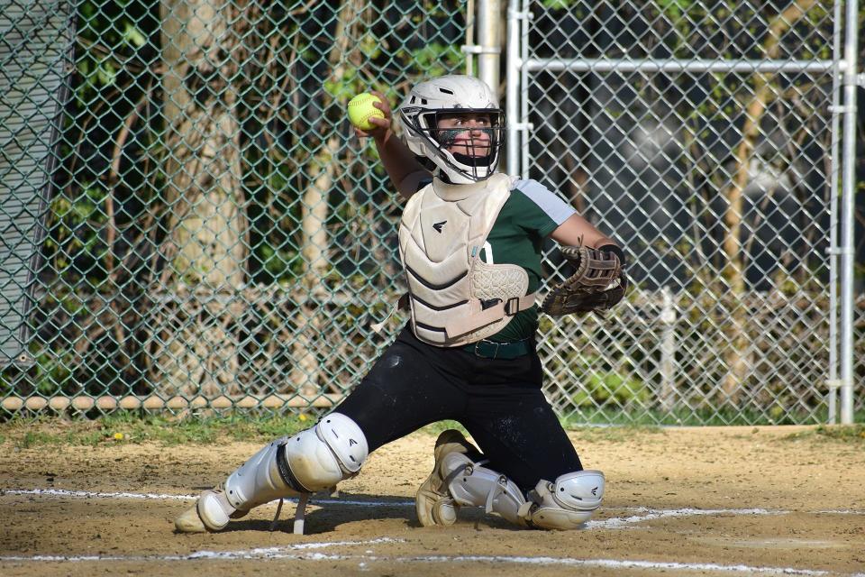 Spackenkill catcher Clare Sottile gathers to throw out an Ellenville base runner during a May 10, 2022 softball game.