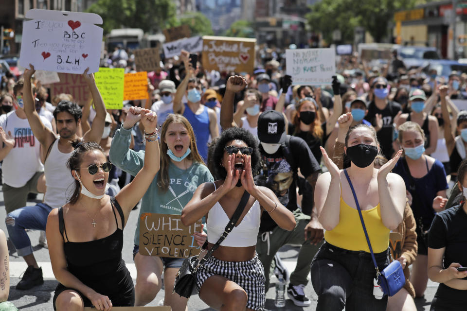 Protesters march through the streets of Manhattan, New York, Sunday, June 7, 2020. New York City lifted the curfew spurred by protests against police brutality ahead of schedule Sunday after a peaceful night, free of the clashes or ransacking of stores that rocked the city days earlier. (AP Photo/Seth Wenig)