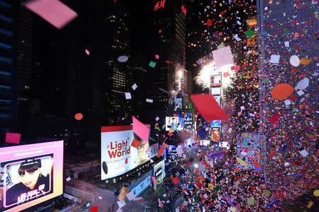 Confetti falls in Times Square just after midnight during New Year celebrations in Manhattan, New York, U.S., January 1, 2018. REUTERS/Darren Ornitz