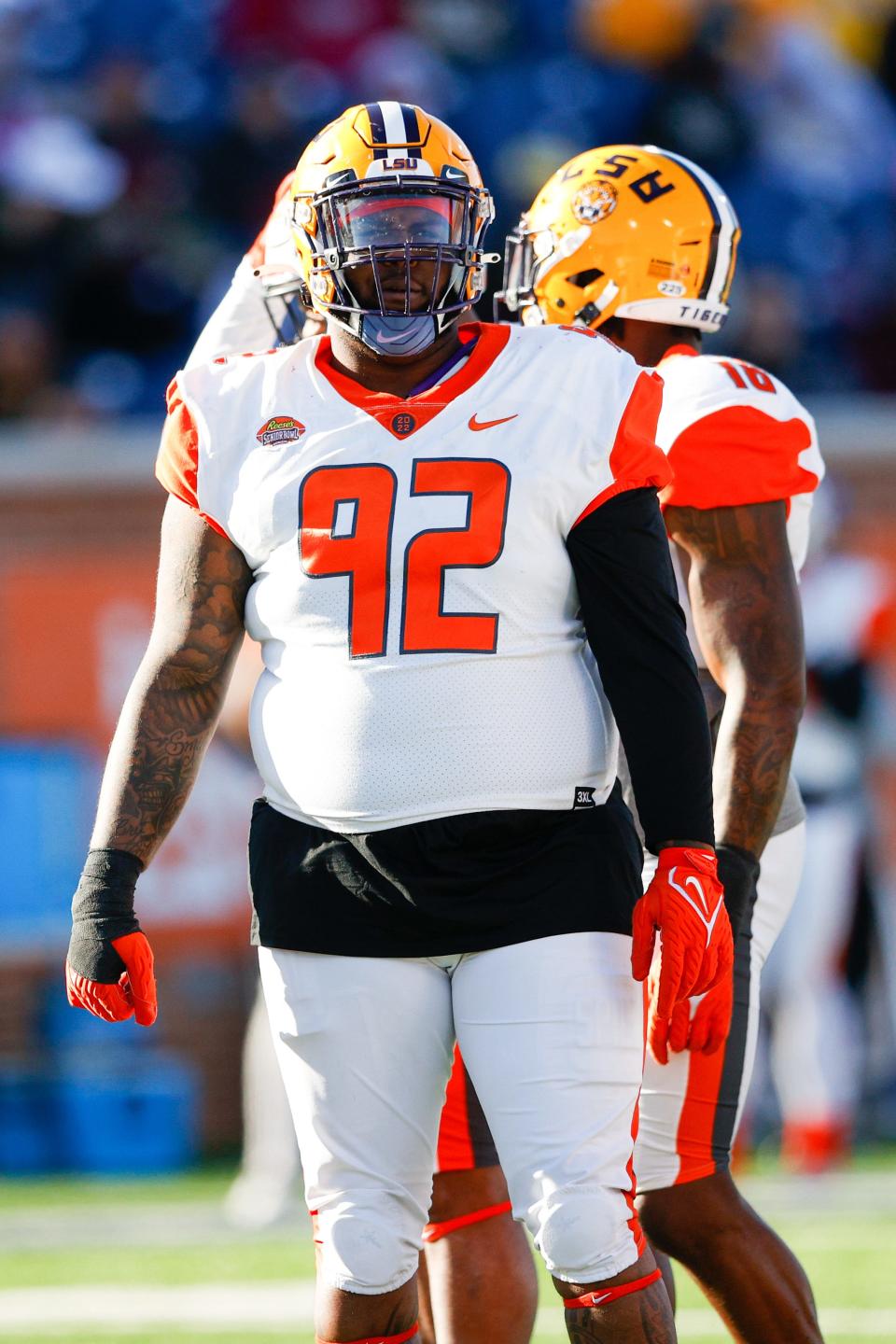 Feb 5, 2022; Mobile, AL, USA;  American squad defensive linemen Neil Farrell Jr. of LSU (92) looks on in the second half against the National squad during the Senior bowl at Hancock Whitney Stadium. Mandatory Credit: Nathan Ray Seebeck-USA TODAY Sports