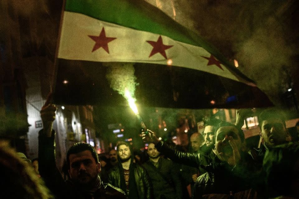 Protesters hold a Syrian flag during a demonstration against Russia in Istanbul. Photo: AFP